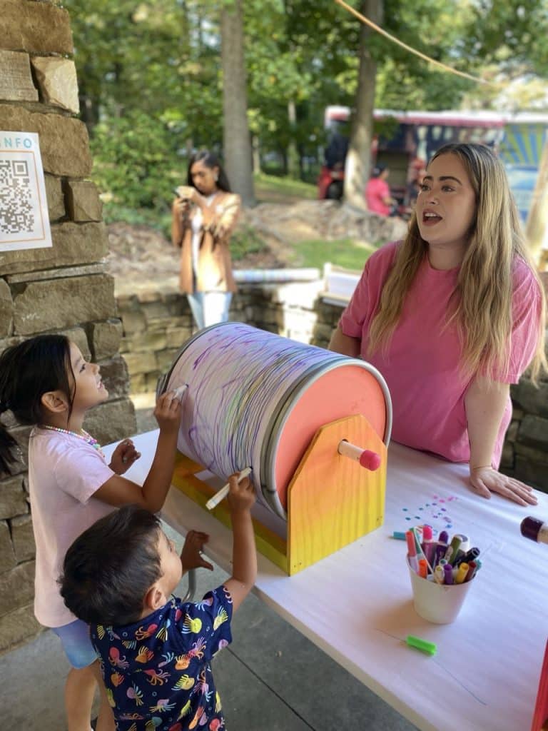 Finished spinning art barrel on a colorful handmade wooden stand