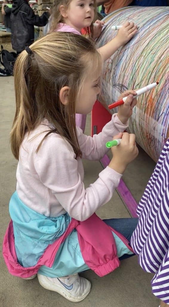 DIY giant spinning art barrel for kids made from a 55-gallon fiber drum